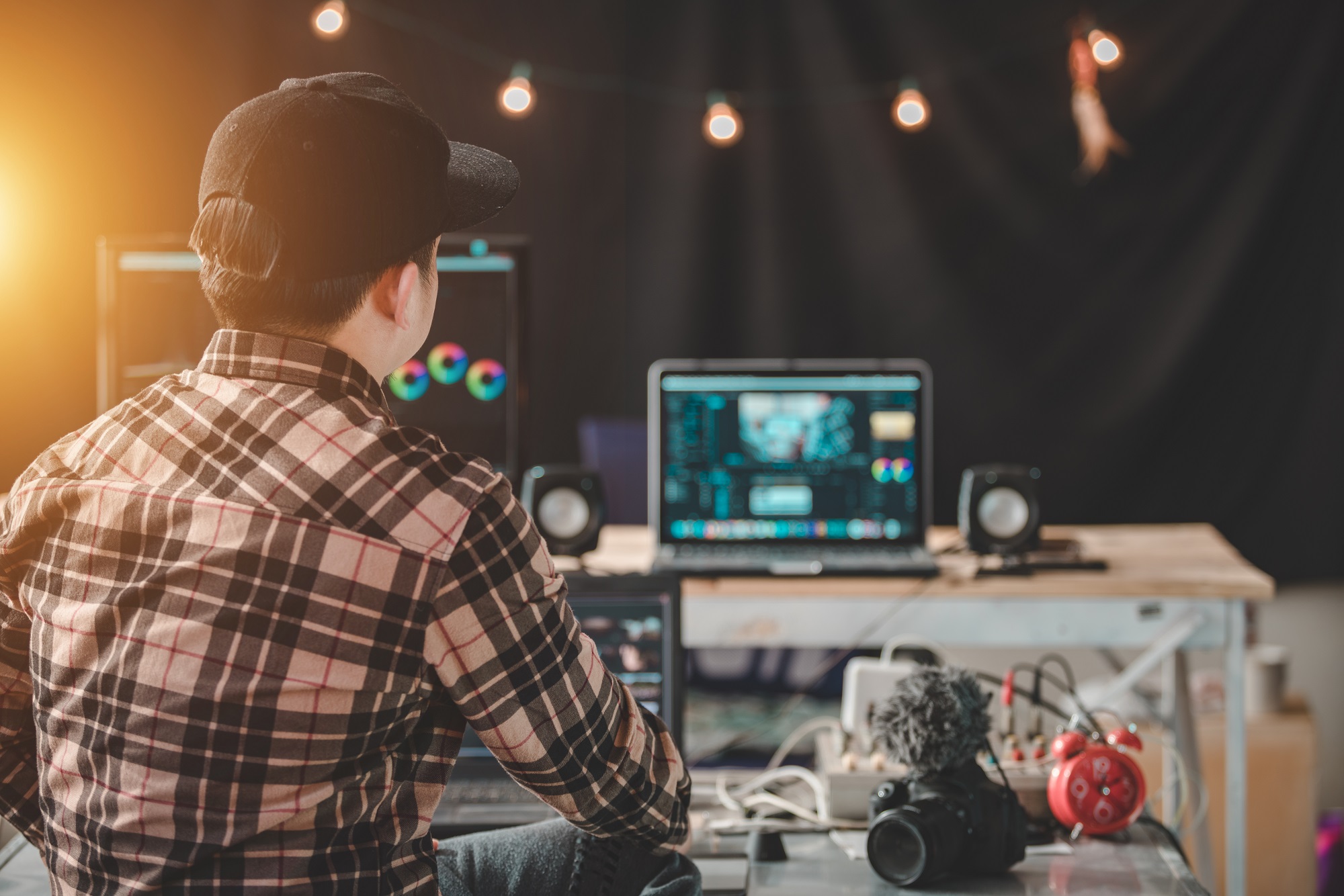 Young man content creator he is working in the house studio with